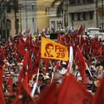 Global May Day Protests 2026 workers marching with banners